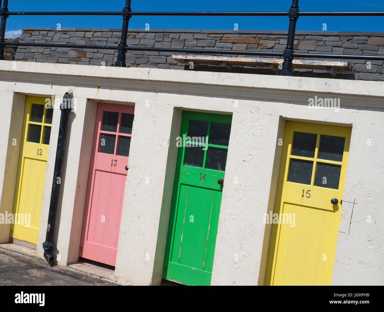 Colourful doors to former outdoor swimming pool changing rooms near the harbour at North Berwick Stock Photo