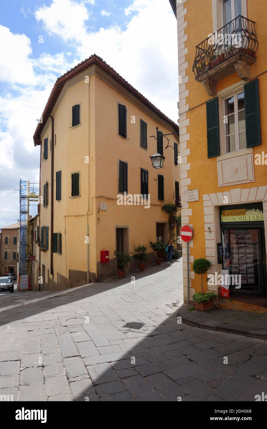 Woman walking down a street,Montalcino Tuscany Stock Photo