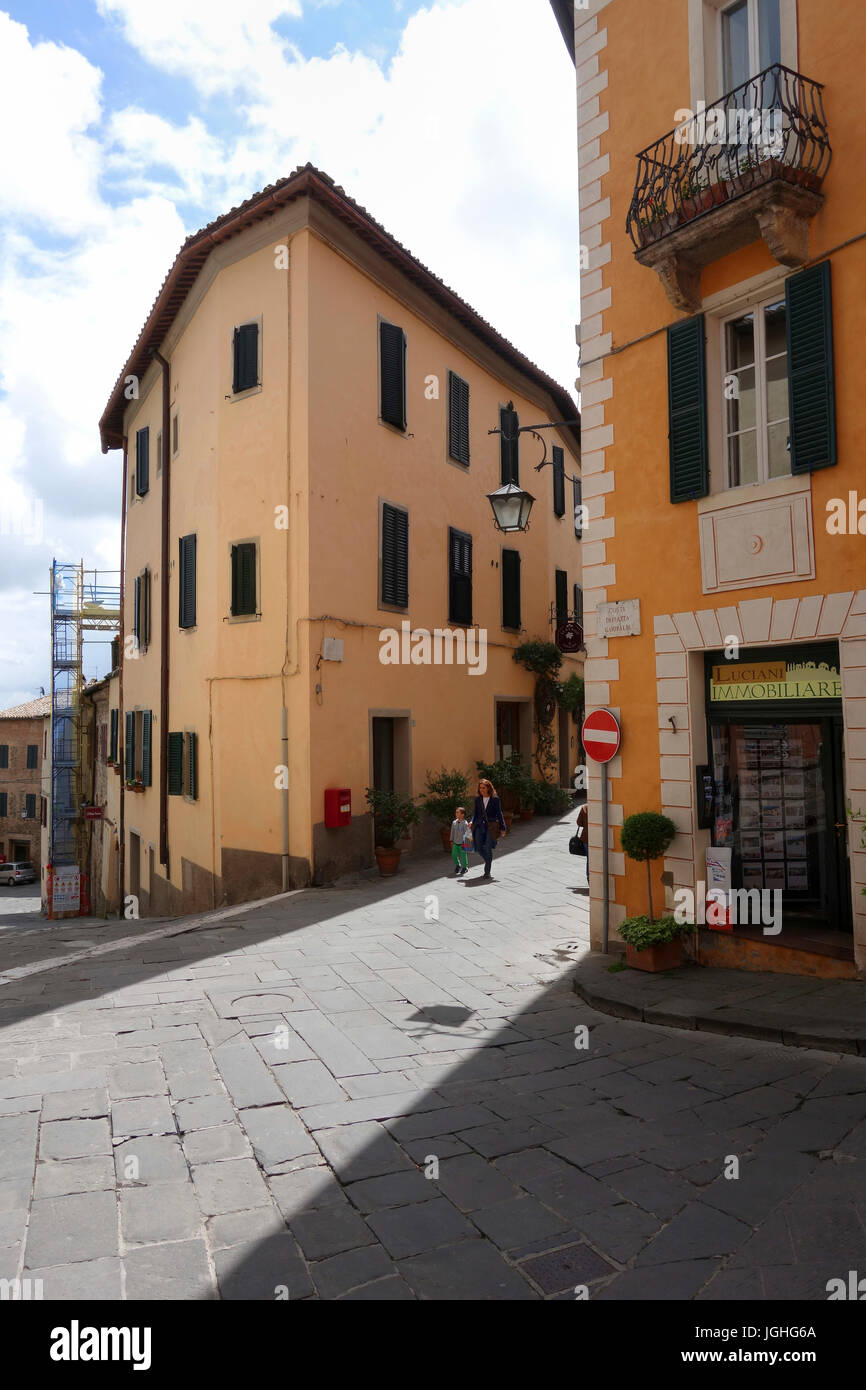 Woman and child walking down a street,Montalcino Tuscany Stock Photo