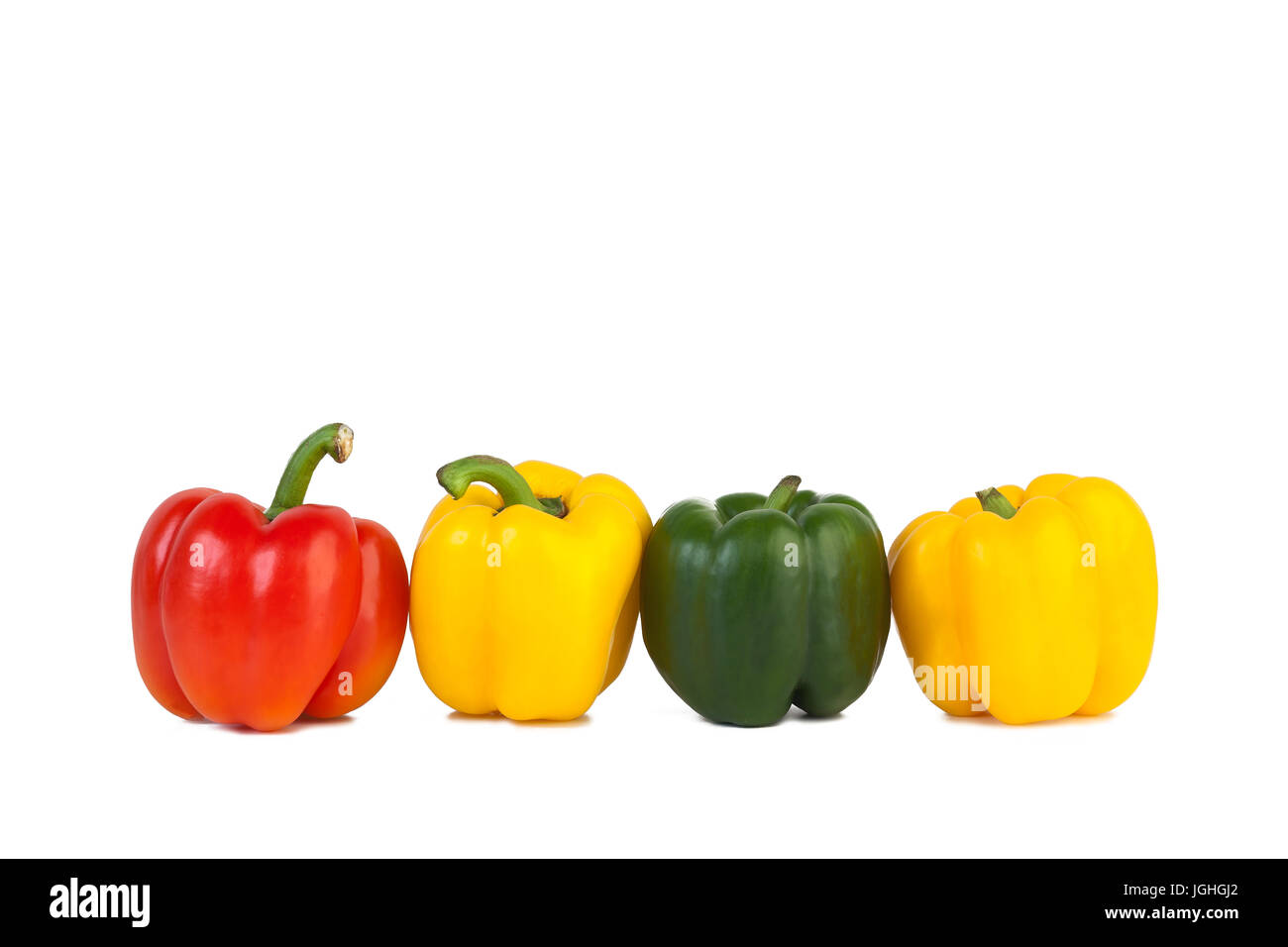 Four sweet peppers red, yellow and green on isolated white background ...