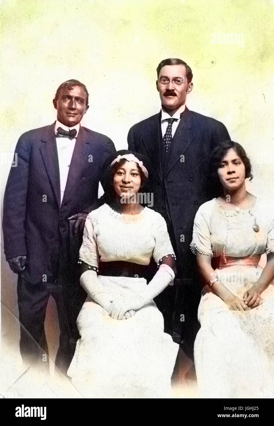 Portrait of African-American family wearing suit and formal dress, in