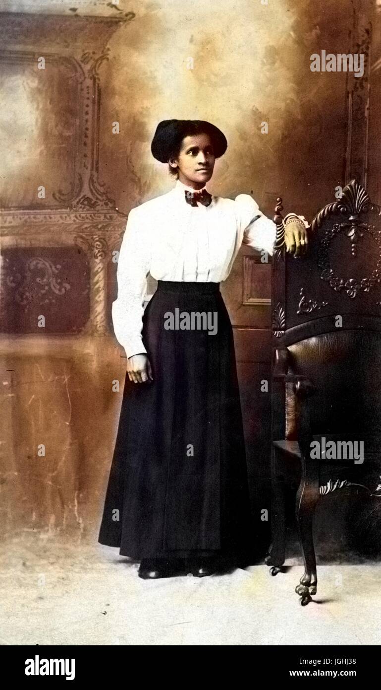 Full-length portrait of an African American woman standing in front of ...