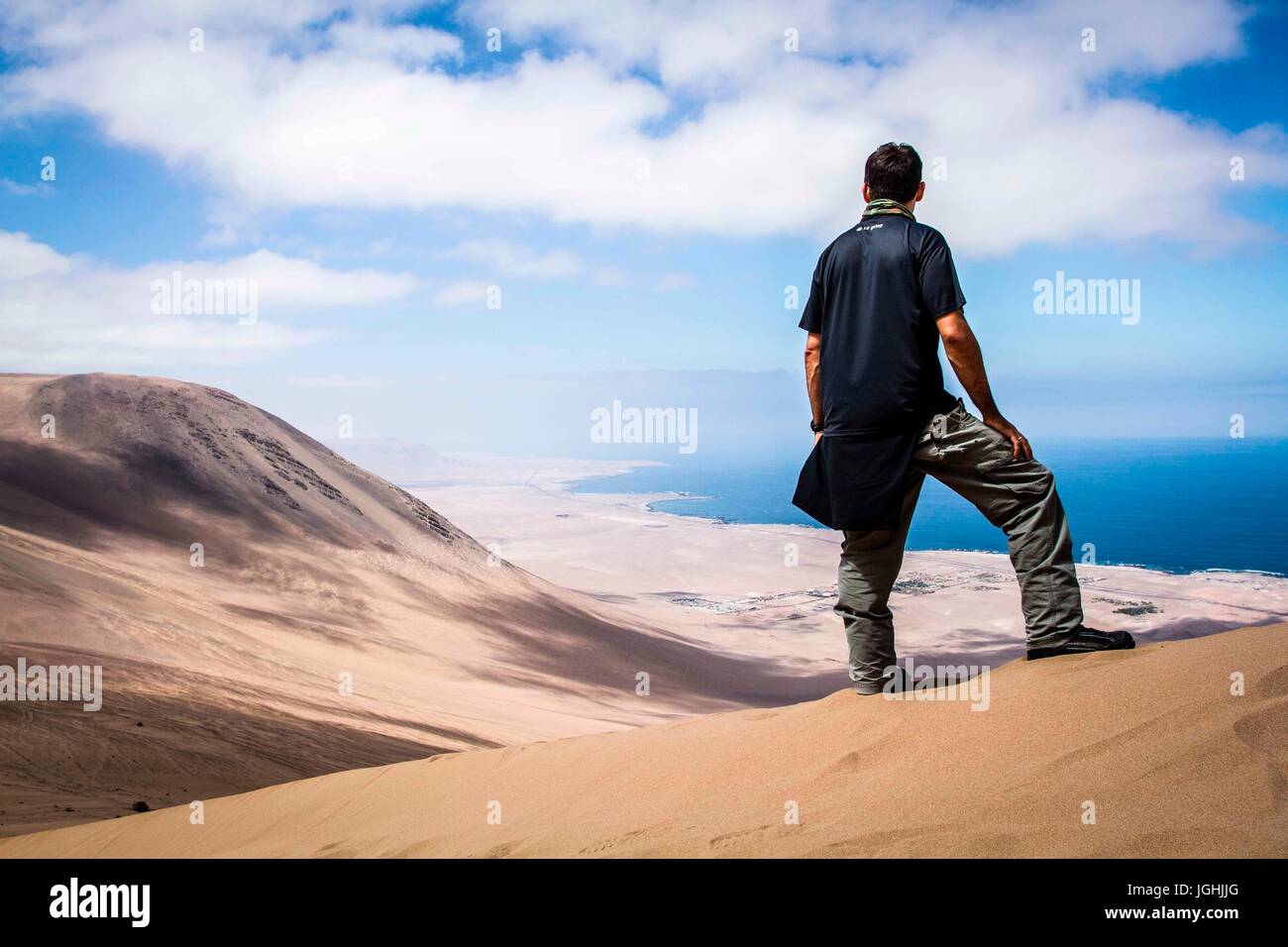 man looking at the view from Alto los Verdes, . Iquique, Tarapaca Region, Chile 19.11.15 Stock Photo