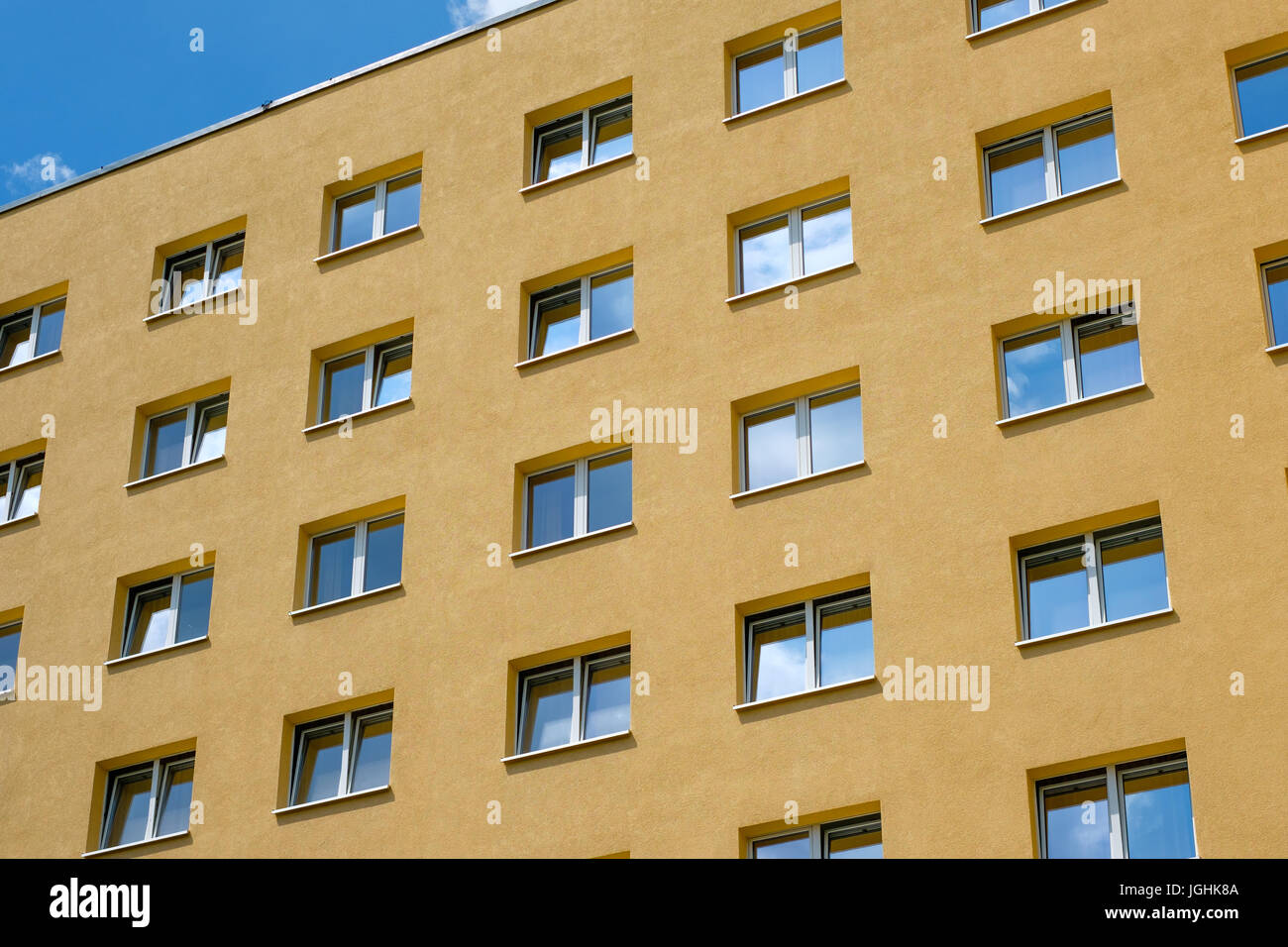 yellow house facade - windows, building exterior Stock Photo - Alamy