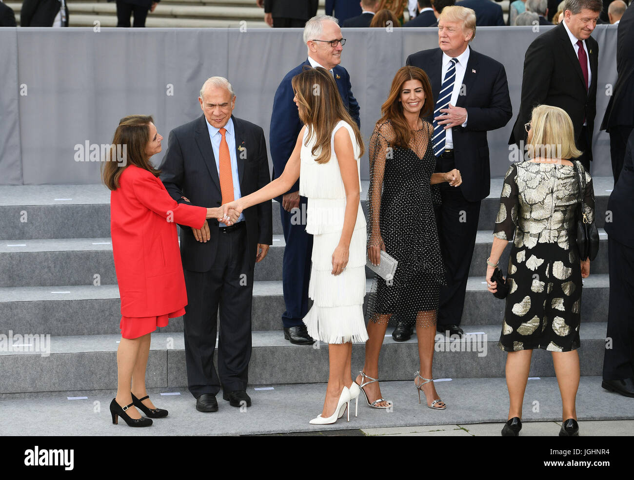 Melania Trump greets Jos&eacute; &Aacute;ngel Gurr&iacute;a (second left)  and his wife Dr. Lulu Quintana (left) as G20 leaders and their spouses  arrive to attend a concert at the Elbphilharmonie concert hall in
