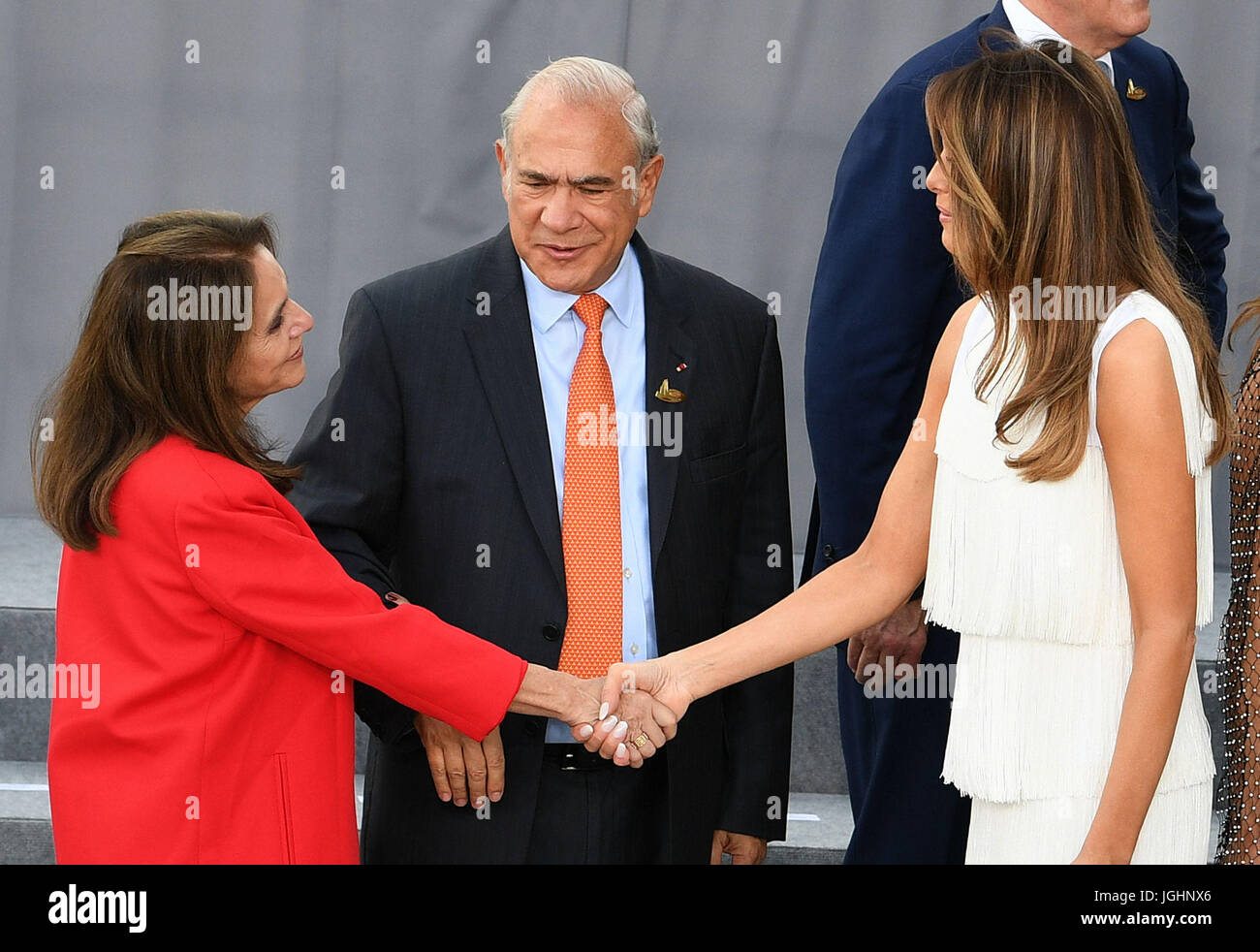 Melania Trump greets Jos&eacute; &Aacute;ngel Gurr&iacute;a and his wife  Dr. Lulu Quintana as G20 leaders and their spouses arrive to attend a  concert at the Elbphilharmonie concert hall in Hamburg Stock Photo -