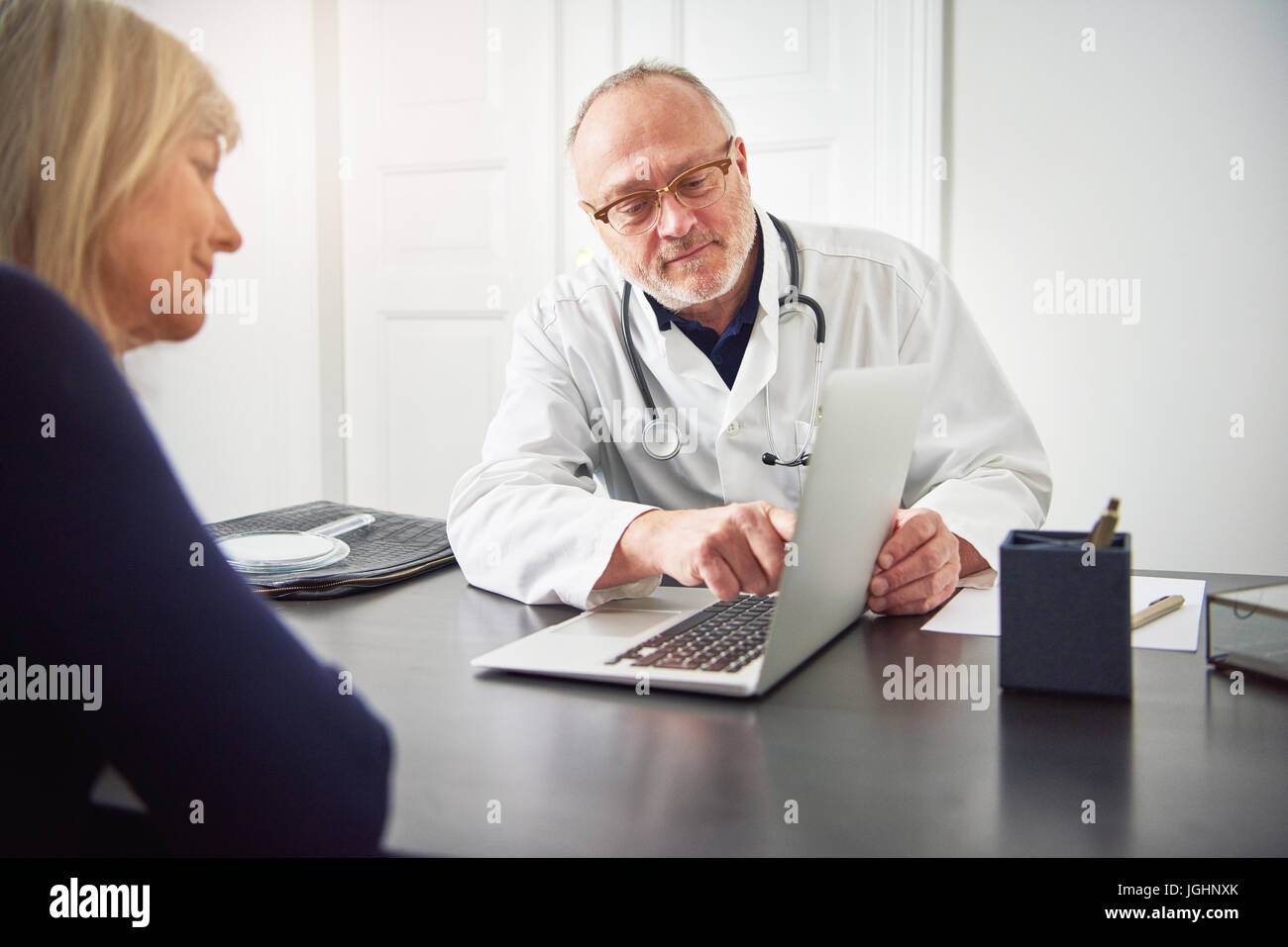 Doctor mature patient conversation hi-res stock photography and images ...