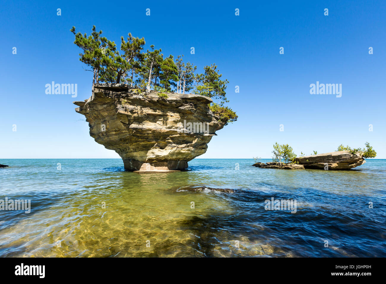 Turnip Rock on Lake Huron in Port Austin Michigan. An underwater view shows rocks under the clear surface of the water Stock Photo