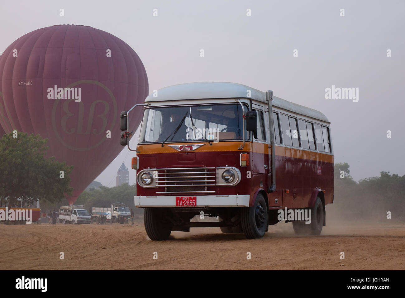 Bagan, Myanmar - Feb 20, 2016. An old bus carrying tourists to hot air ballloon site in Bagan, Myanmar. Ballooning over Bagan is one of the most memor Stock Photo