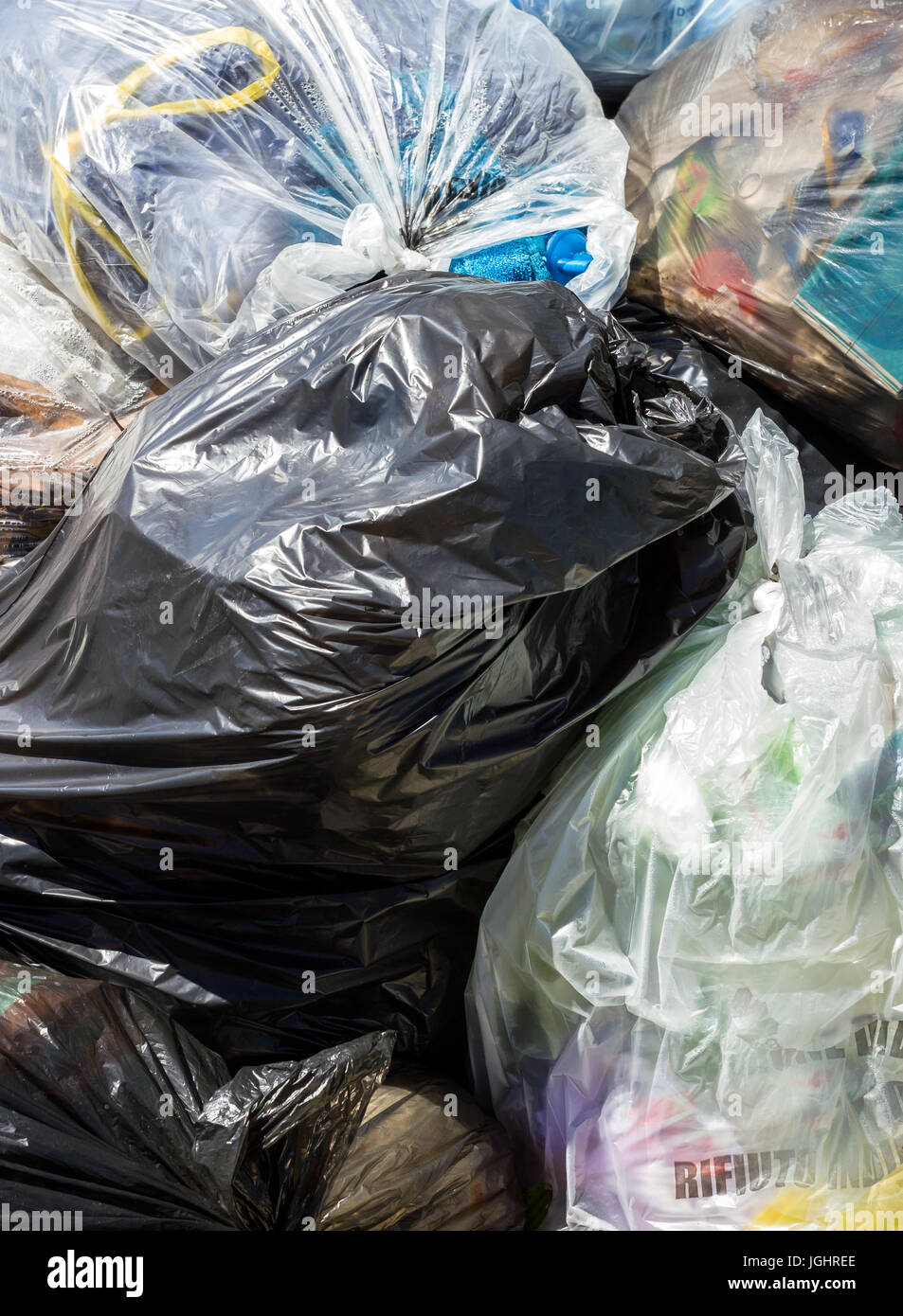 Piles of garbage in plastic bin bags. Landfill. Closeup for background