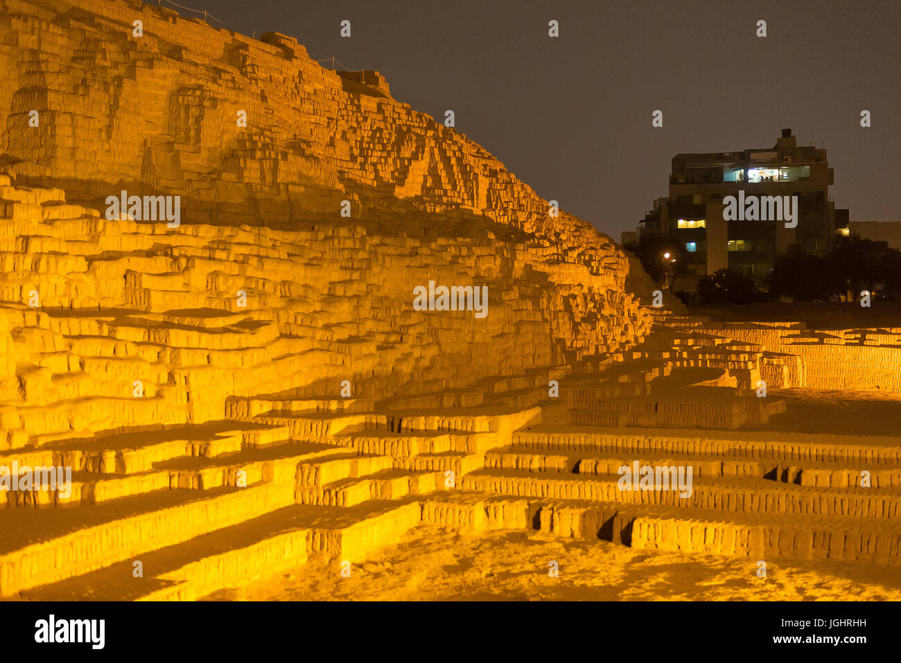 View of the rock formations of Huaca Pucllana from a nearby restaurant Stock Photo