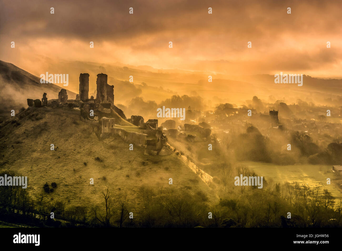Corfe castle misty morning, in Dorset Stock Photo