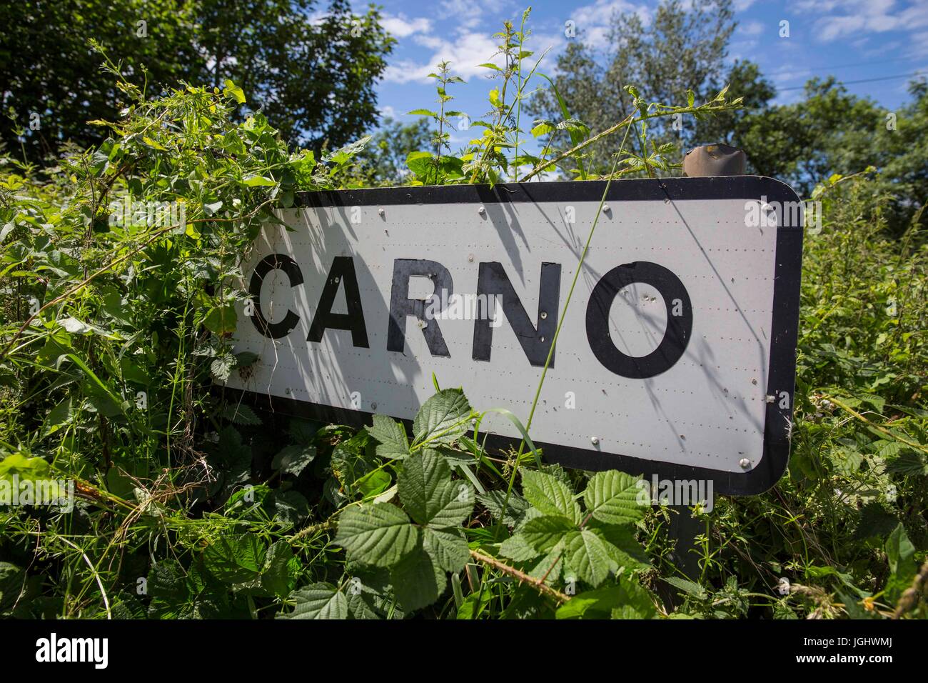 A partially obscured sign-post for the Welsh village of Carno, Powys, Wales, UK. A major stash of LSD is rumoured to be buried in nearby woodland. Stock Photo
