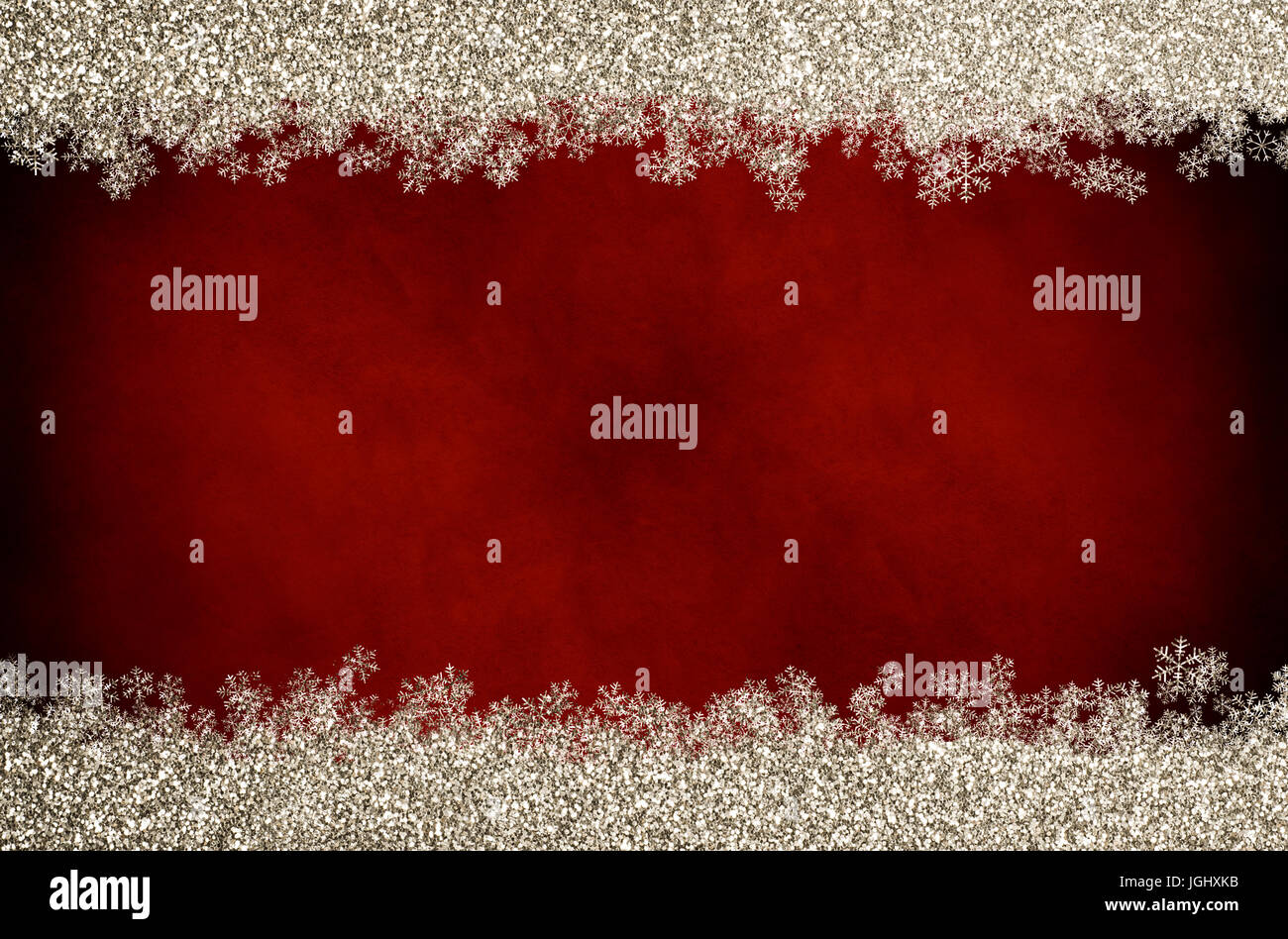 Chriistmas background of dark red vintage parchment with top and bottom border of sparkly gold glitter with glittery snowflakes. Stock Photo