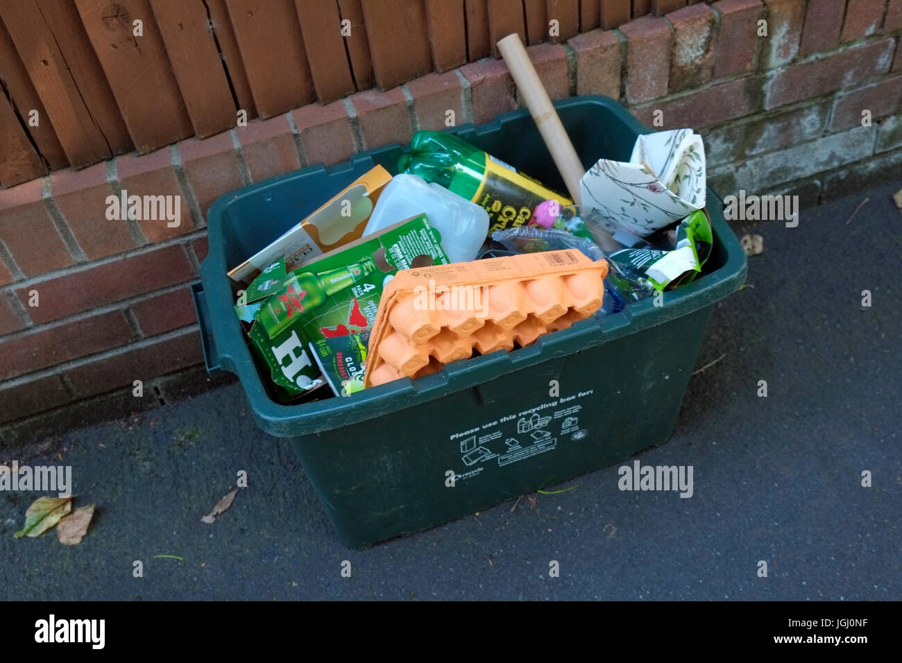 A green recycling bin outside a house in Bristol, UK Stock Photo Alamy