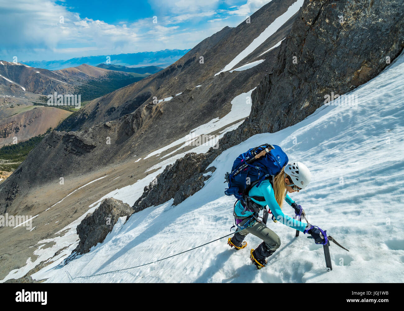Noelle Synder Climbs the North Face of Borah Peak 12,667 near Mackay Idaho Stock Photo