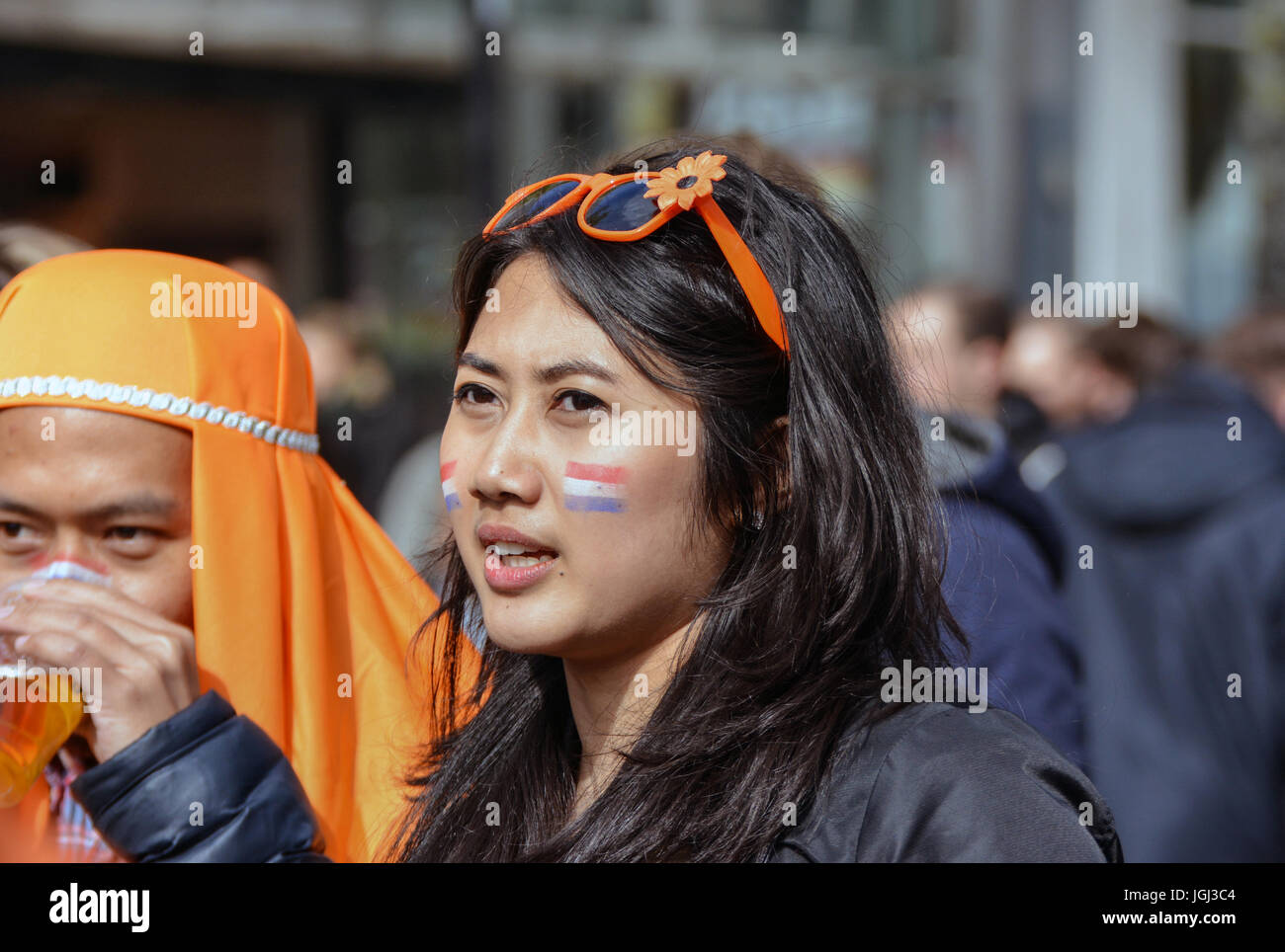 Indonesian Girl With Her Friends Having Fun On Kings Day In Groningen