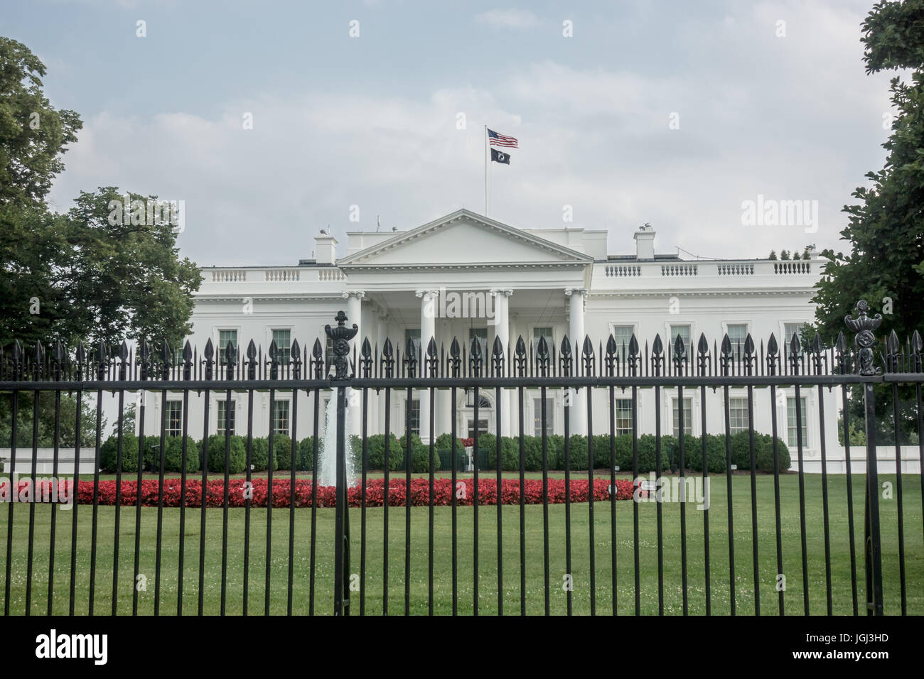 Pow/MIA Flag flies over White House,with American flag; pow/mia flag is raised over White house five days each year, here on Flag Day, June 14, 2017 Stock Photo
