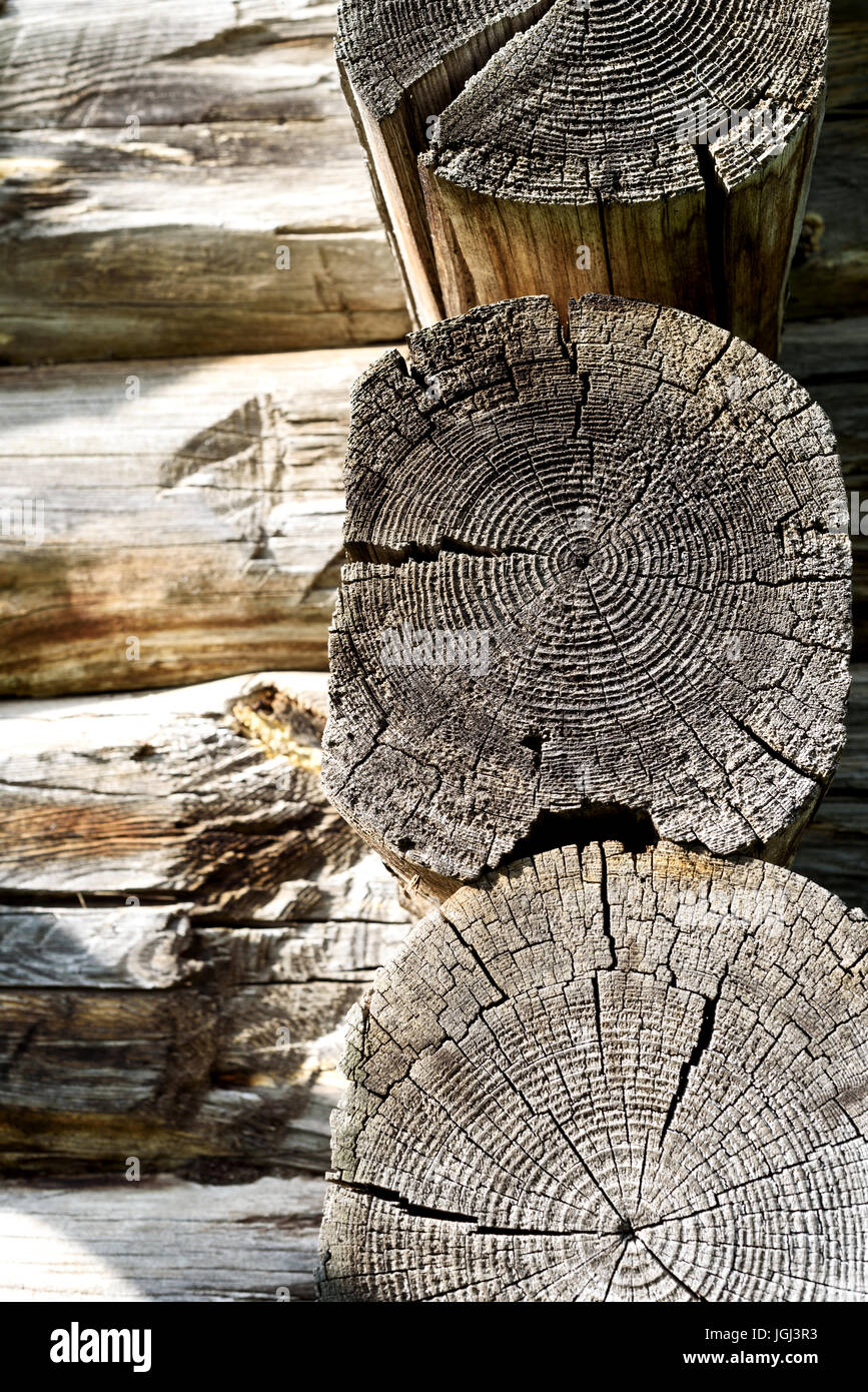 Old dry timber from an old log house. The wooden construction shows signs of age and weathering Stock Photo
