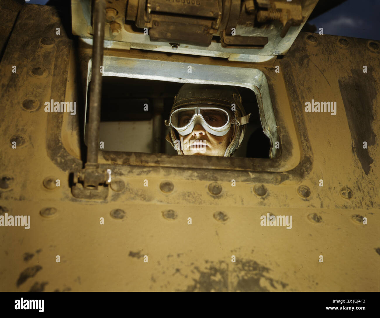 Tank commander peers from a WWII tank at Ft. Knox, Kentucky. Photo : Alfred T. Palmer Stock Photo