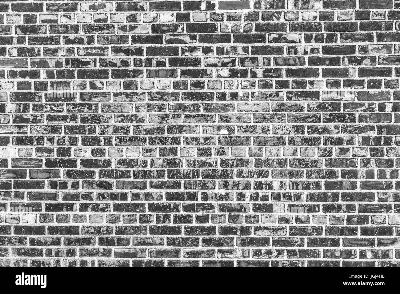Old brick wall background. Grunge texture. Black wallpaper. Dark