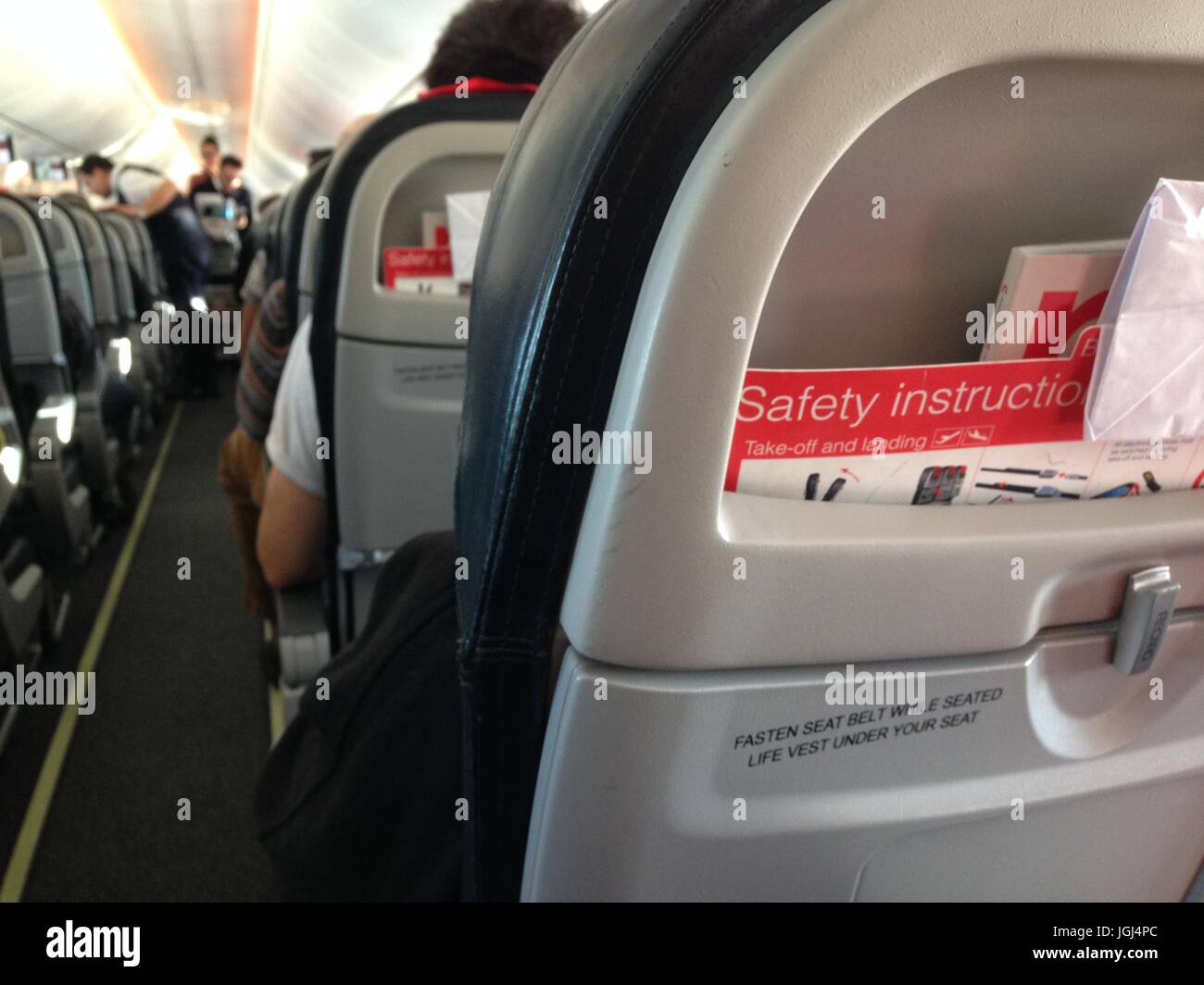 Airplane aircraft plane cabin seats from back of airplane Stock Photo