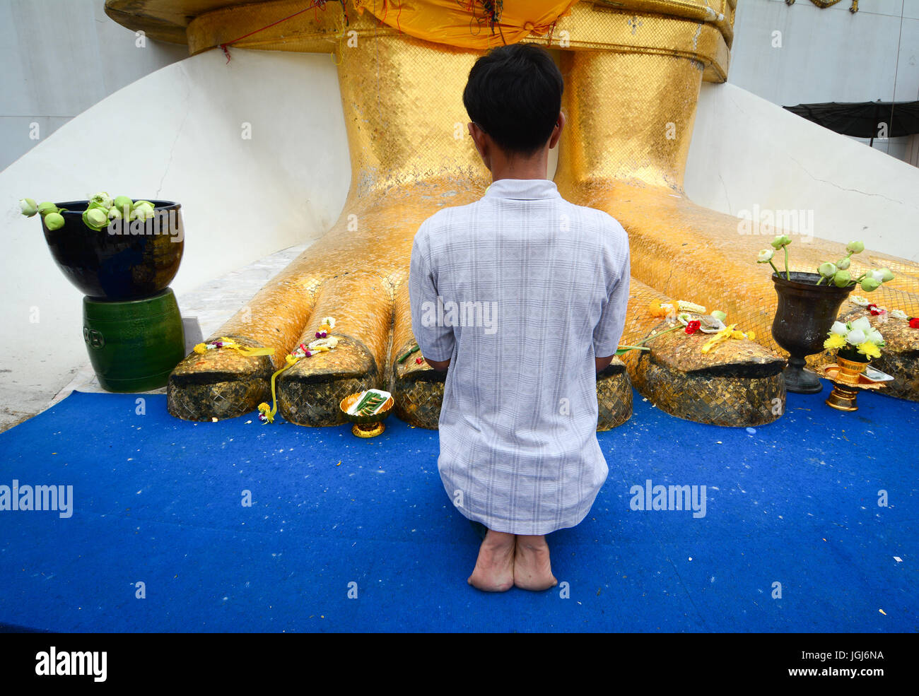 Buddhism praying on knees hi-res stock photography and images - Alamy