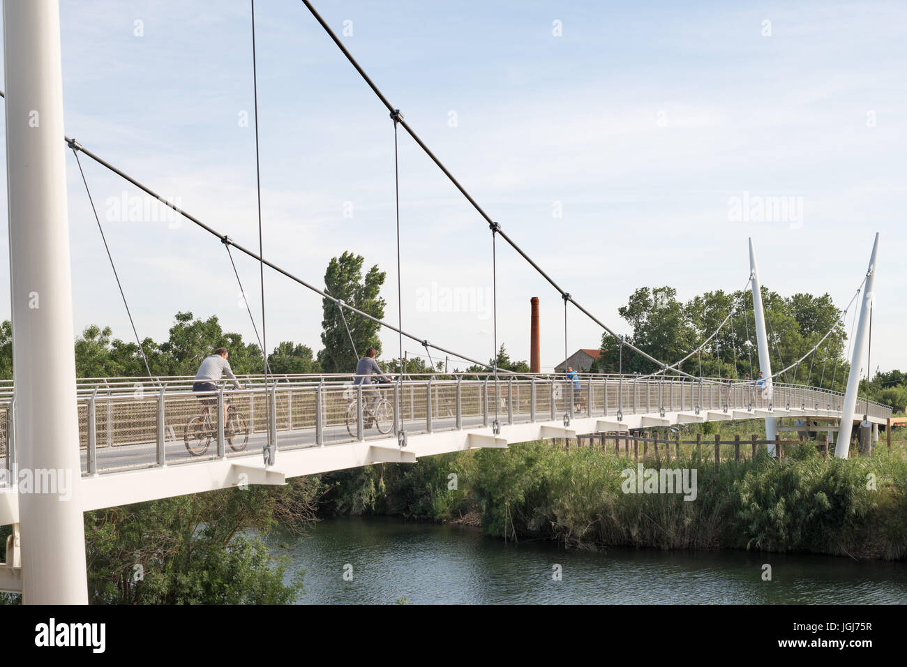 Footbridge carrying cycle path over river Orb, Sérignan, Hérault department, France Stock Photo