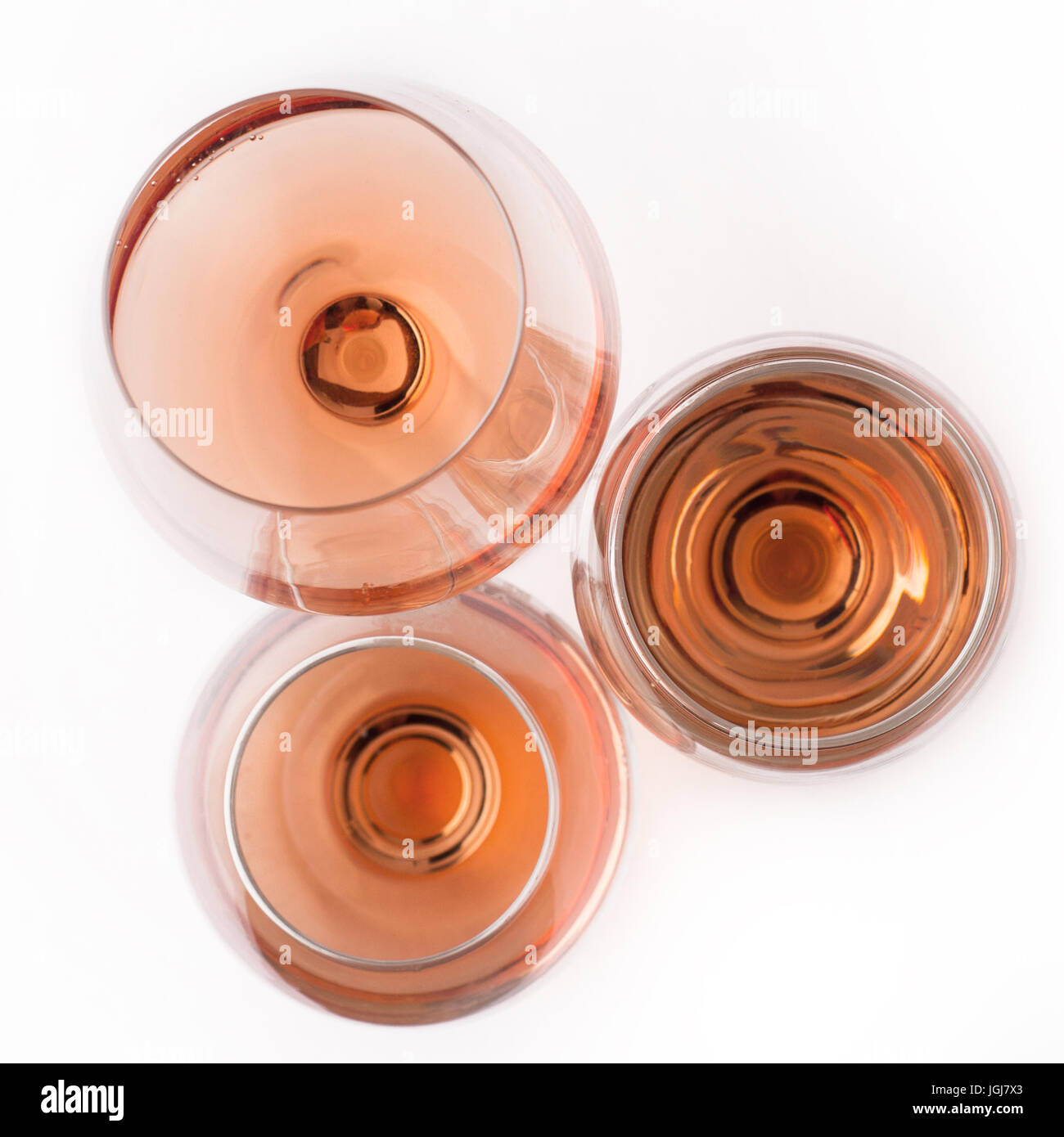 top view of three rose wine glasses of different shapes and sizes