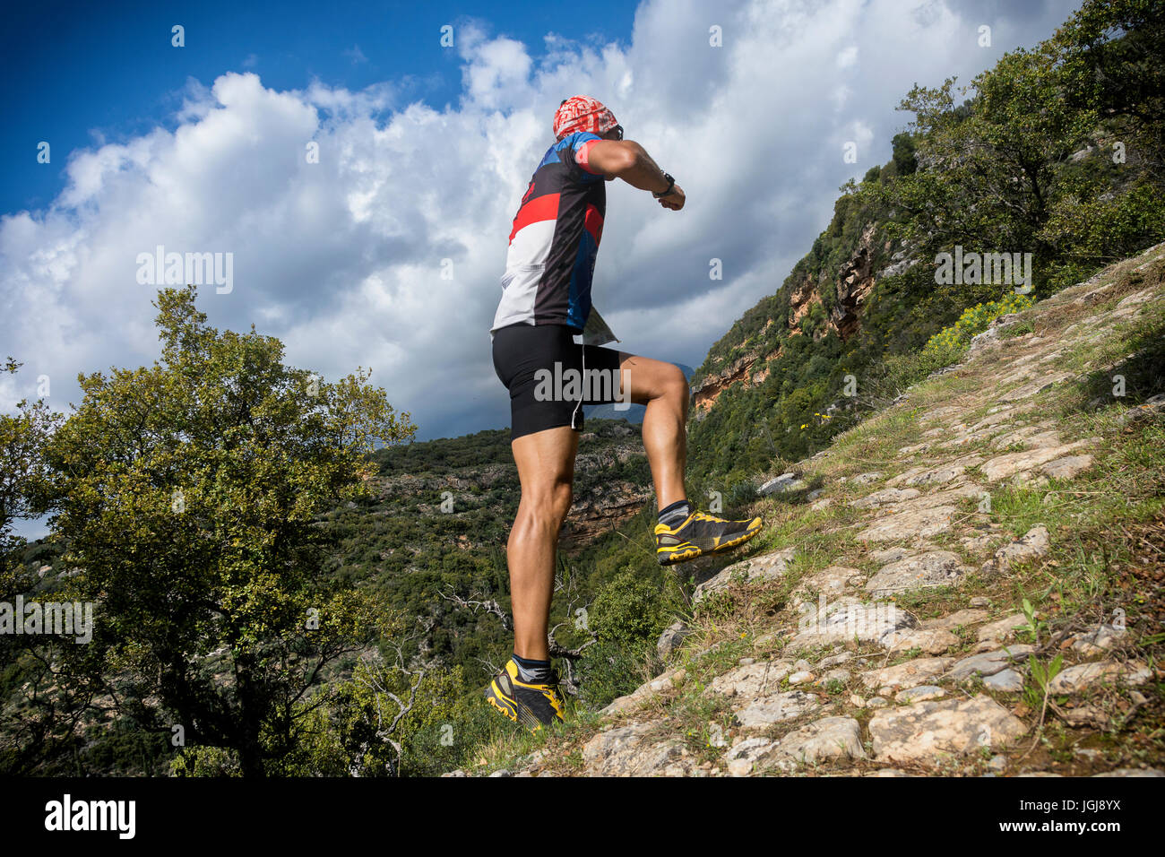 trail runner on vertical uphill race Stock Photo