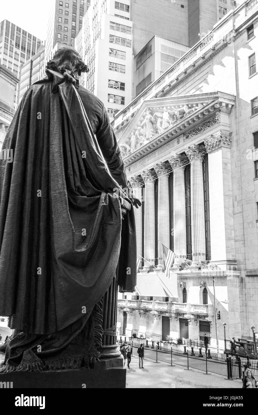 New York Stock Exchange from behind president George Washington statue in Wall street, Manhattan Stock Photo
