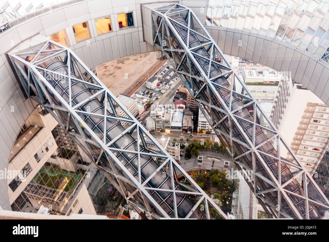 Japan, Osaka. Umeda Sky Building, view from top. The two metal framework enclosed glass escalator shafts that traverse from the 35th to the 39th floor. Stock Photo