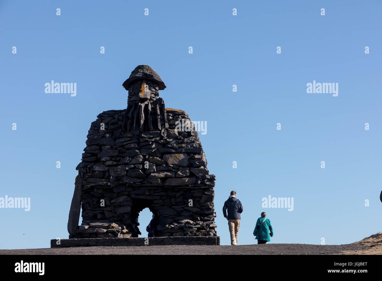 Arnarstapi, Iceland - March 31, 2017: Statue of Bardur Snaefellsnes, half-man, half-giant that is said to roam the Snaefellsnes glacier in Iceland. Ma Stock Photo