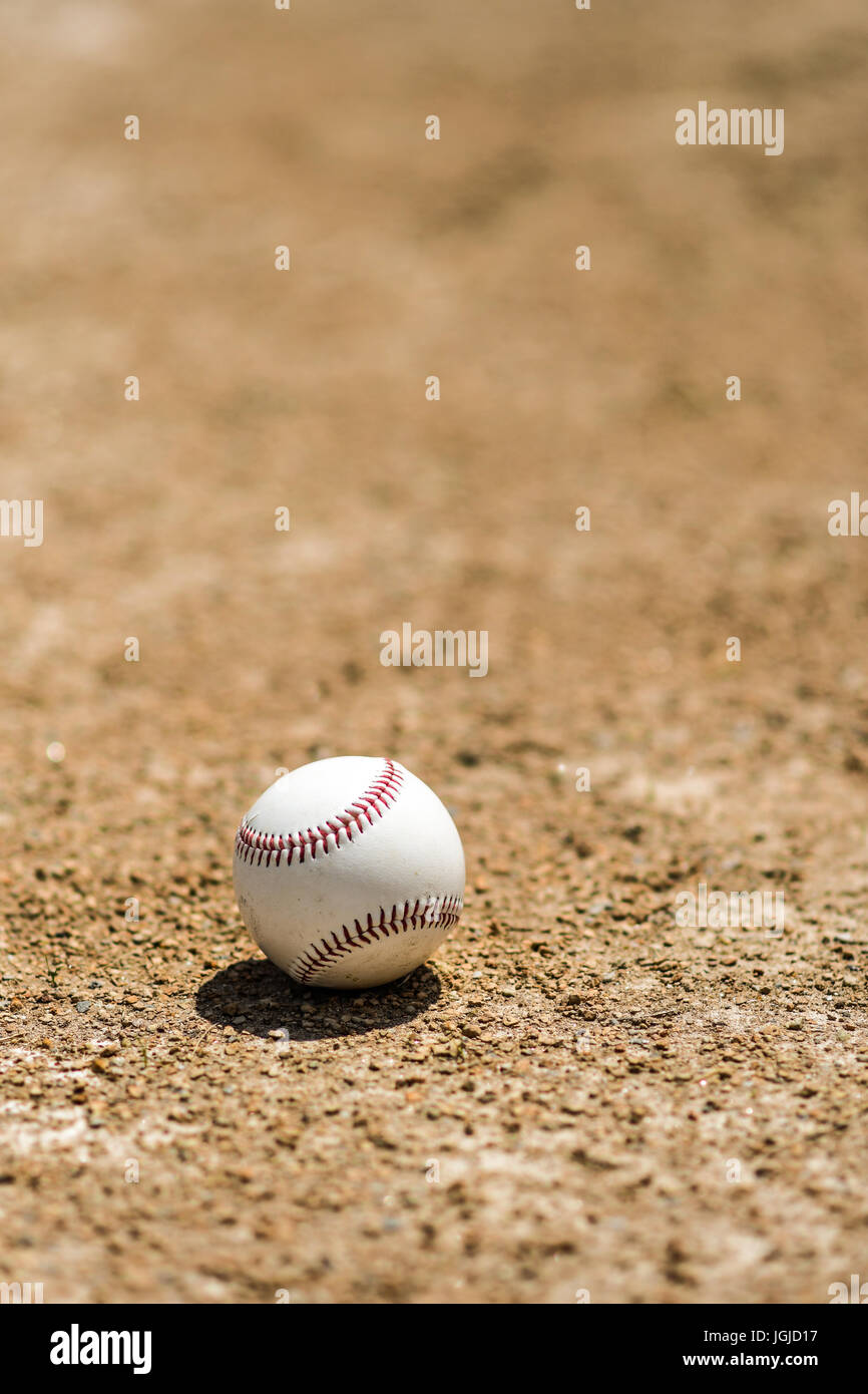 Baseball on the infield dirt of a ball field Stock Photo