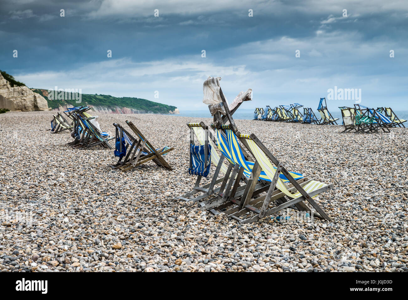 Deck chair on pebble beach hi-res stock photography and images - Alamy