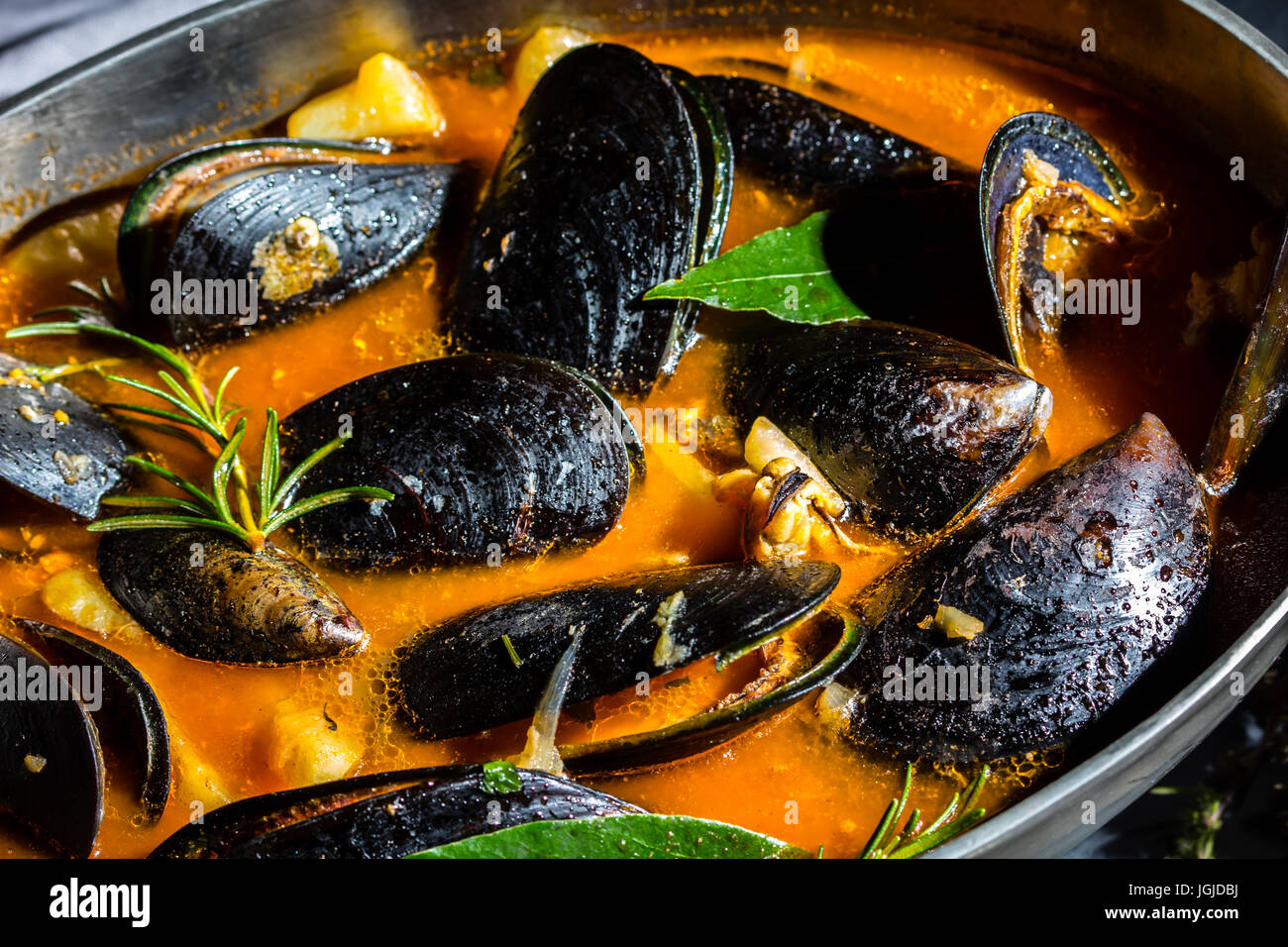 Seafood mussels tomato soup in metal pot Stock Photo Alamy