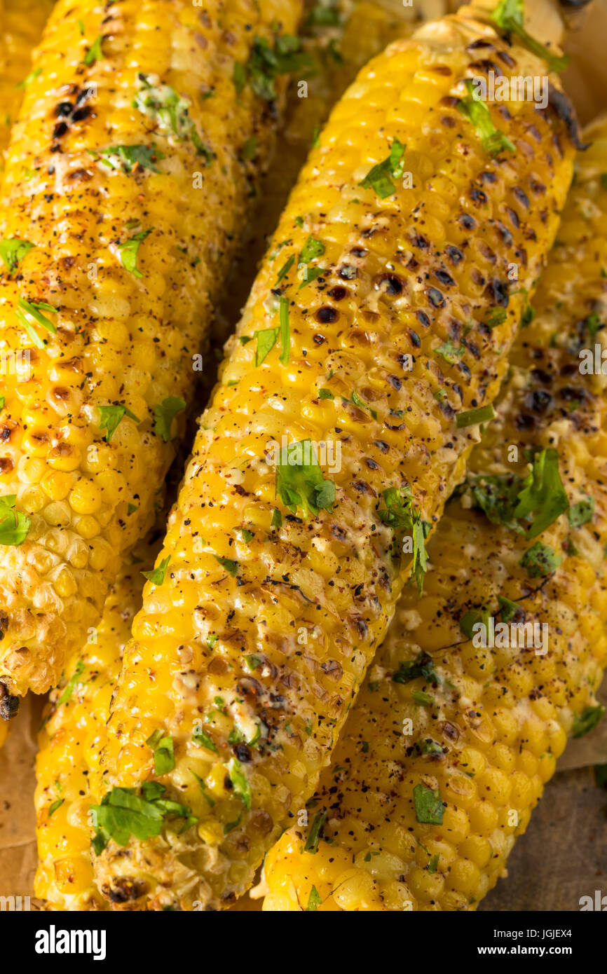 Barbecued Homemade Elote Mexican Street Corn with Mayo and Chili Powder Stock Photo