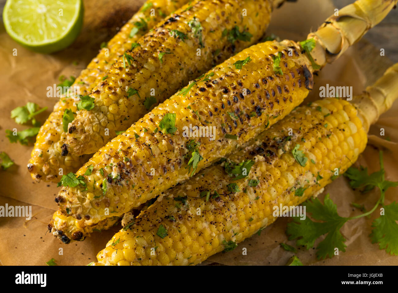 Barbecued Homemade Elote Mexican Street Corn with Mayo and Chili Powder Stock Photo