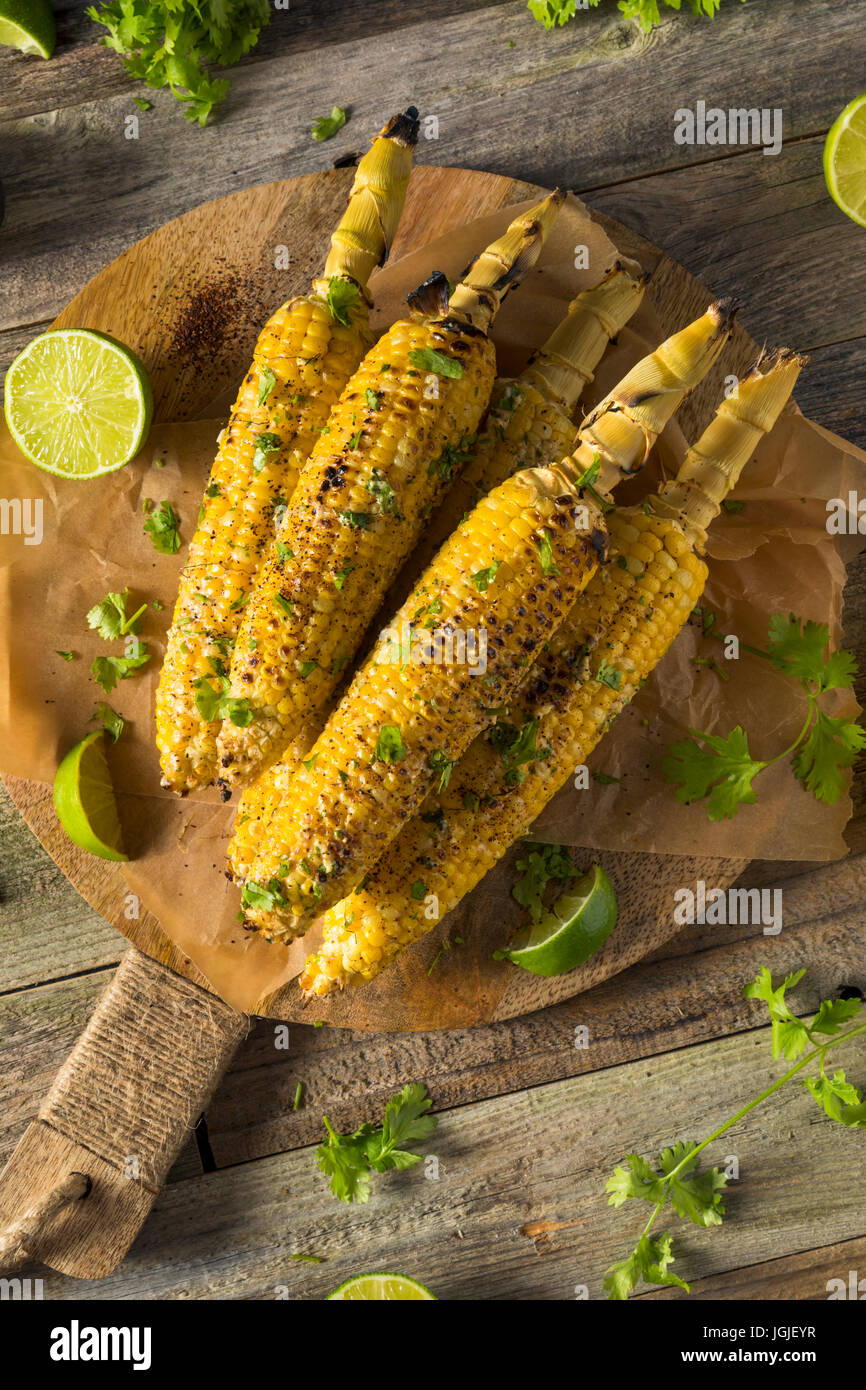 Barbecued Homemade Elote Mexican Street Corn with Mayo and Chili Powder Stock Photo