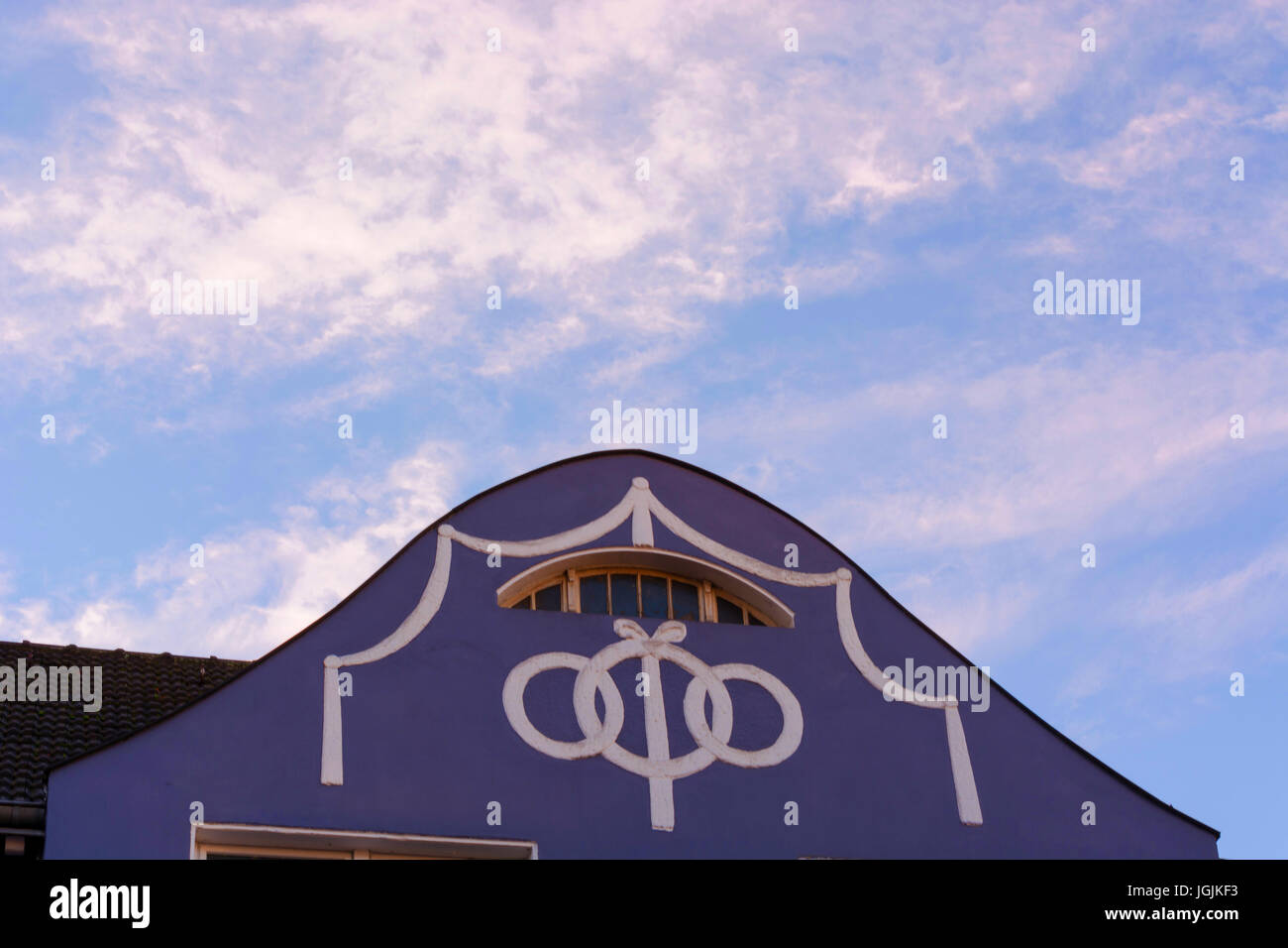 House gable, residential house facade with stucco work. Stock Photo