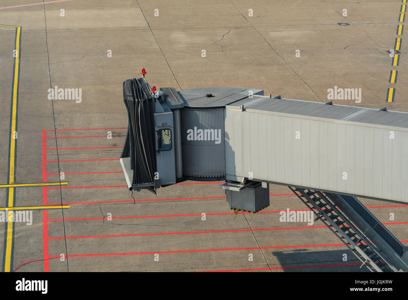 Airplane bridge, footpath in the airport for passengers entering or leaving the plane. Stock Photo