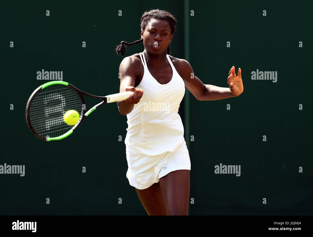 Esther Adeshina in the girls singles on day six of the Wimbledon  Championships at The All England Lawn Tennis and Croquet Club, Wimbledon  Stock Photo - Alamy