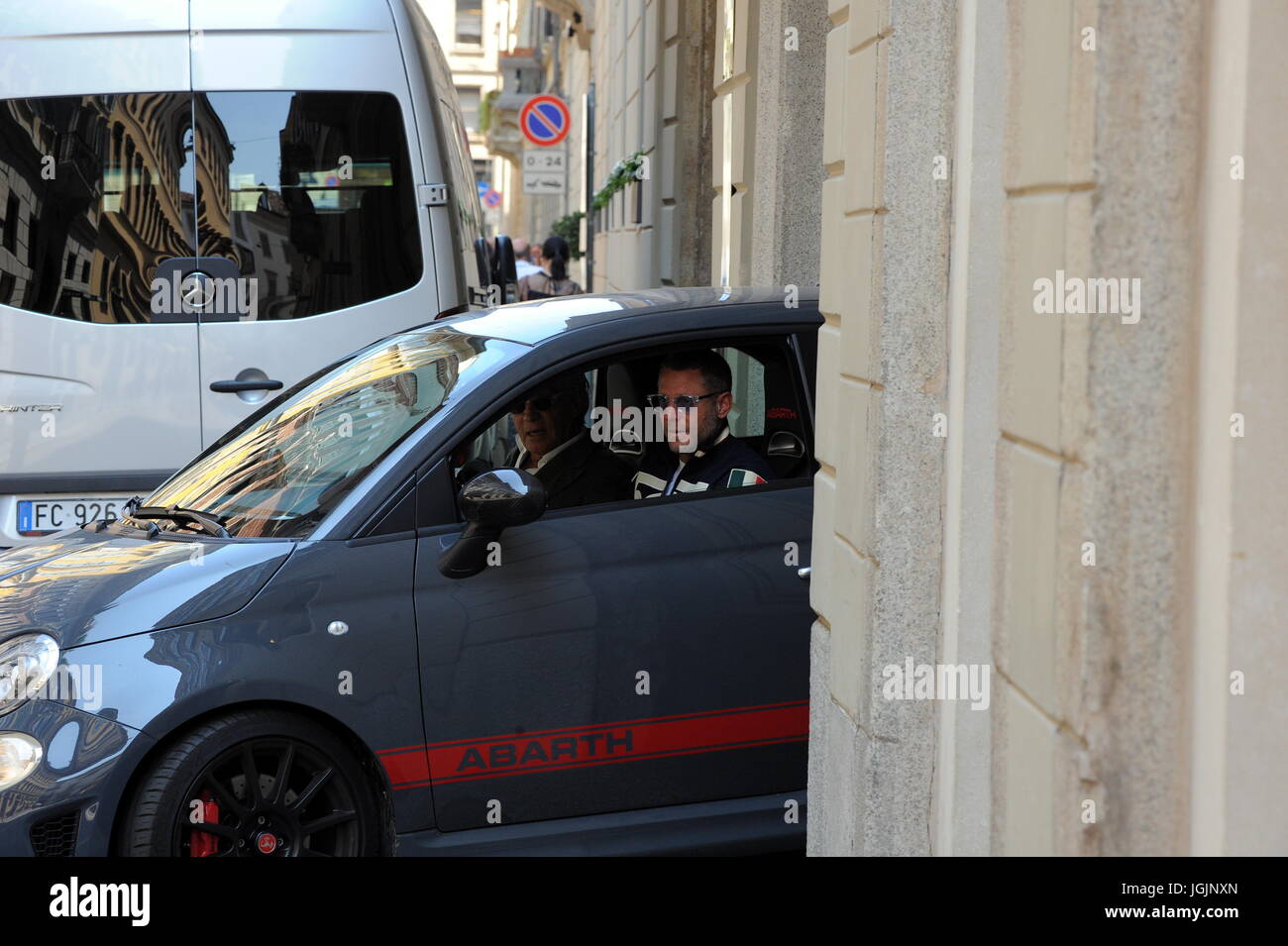 Milan, Lapo Elkann goes to lunch in downtown with Fiat500 anniversary sweater Lapo Elkann arrives in the center dressed casually, sporadically, and wearing tattered trousers and a Fiat500 sweater, to celebrate the 60th anniversary of the legendary car, park the His car at the 'Four Seasons Hotel' goes to a working lunch. After eating at the 'Salumaio di Montenapoleone' greets her customer friend, she handles her Fiat 500 and returns to the office. Stock Photo