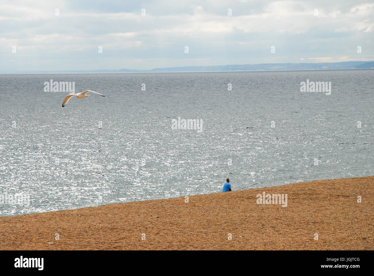 Chesil Beach, Dorset, UK. 7th July, 2017. People enjoy fishing on a balmy Chesil Beach, West