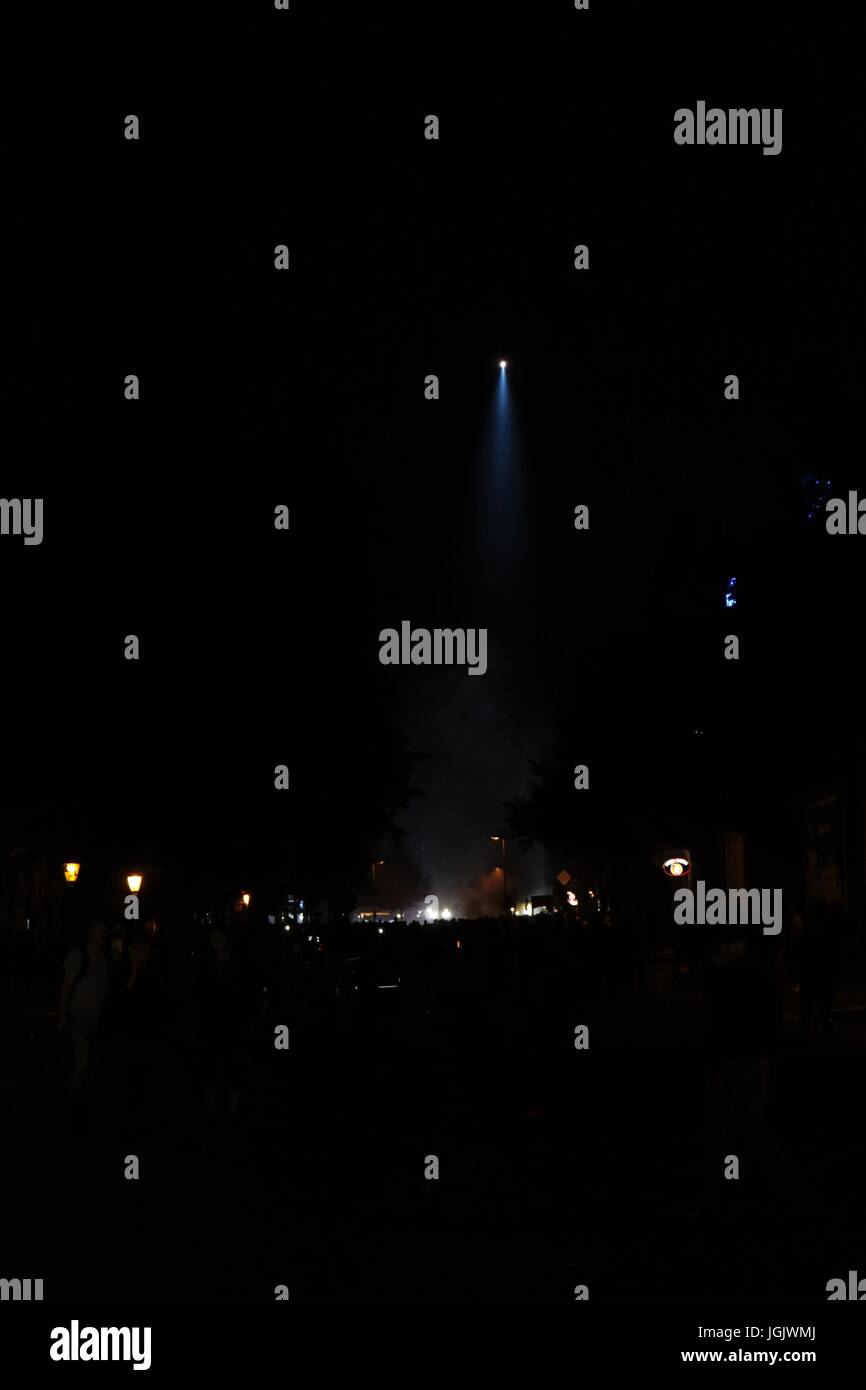 G20 Summit protests in Hamburg. Police helicopters shine a spotlight on a crowd of rioters Credit: Conall Kearney/Alamy Live News Stock Photo
