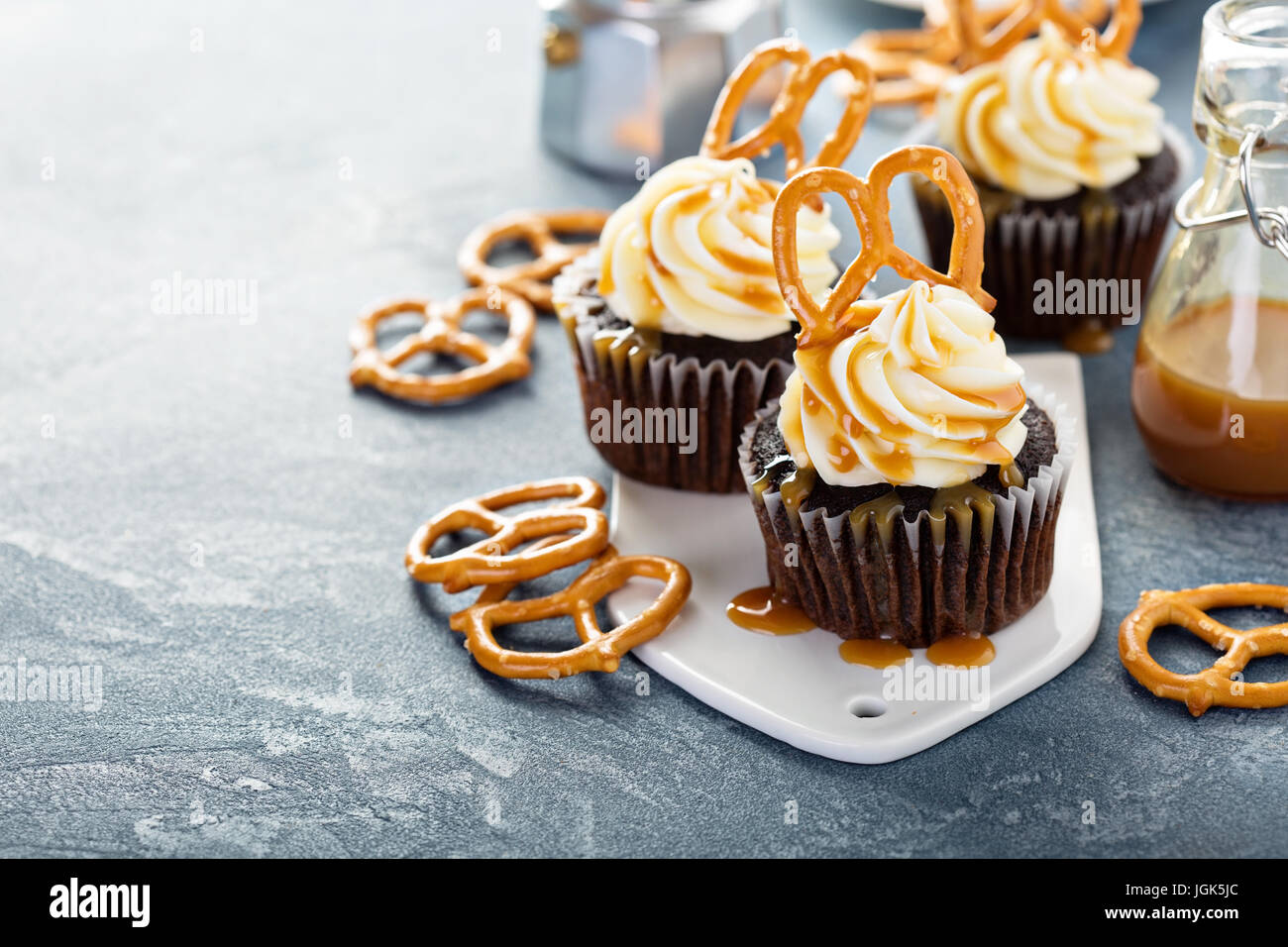Salted caramel cupcakes with pretzels Stock Photo