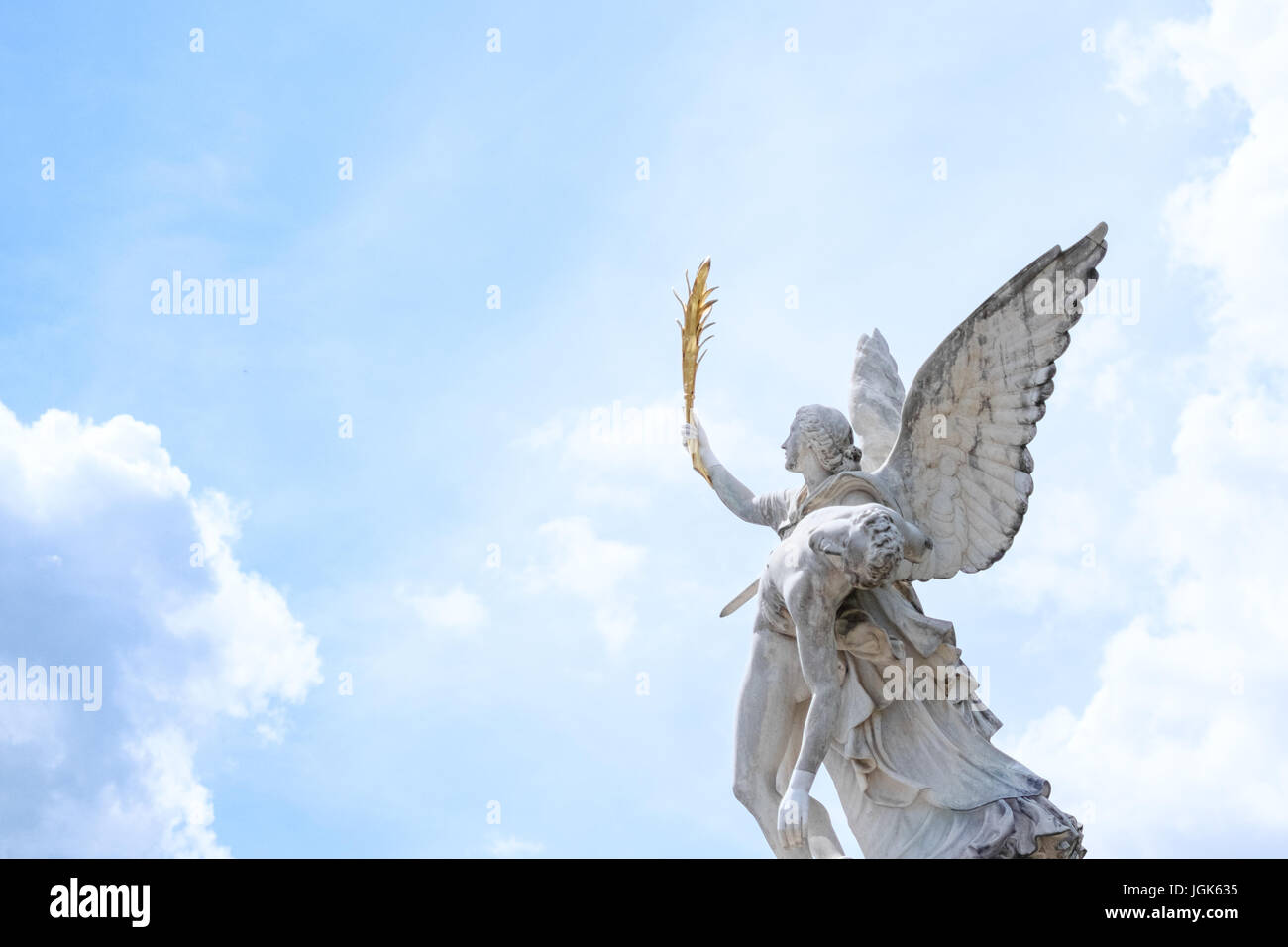Angel statue with cloud sky background - Greek Goddess Nike takes the  fallen hero to Olympus Stock Photo - Alamy