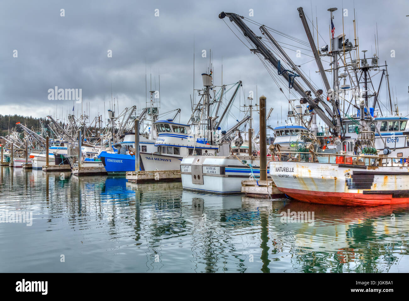 Colorful fishing boats with reflections in the marina at Kodiak, Alaska
