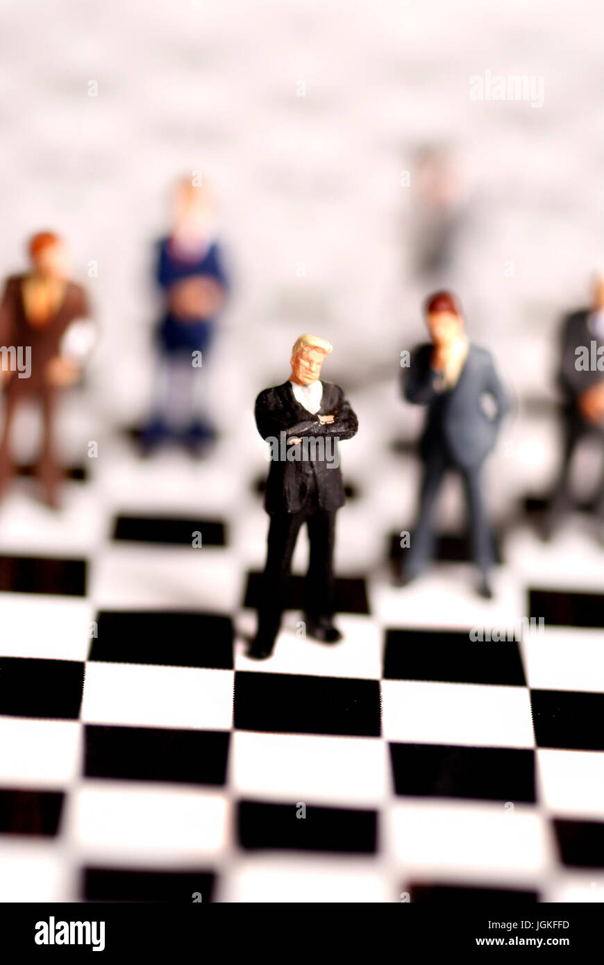 businessmen figurines on a chessboard, management and decision making concept Stock Photo