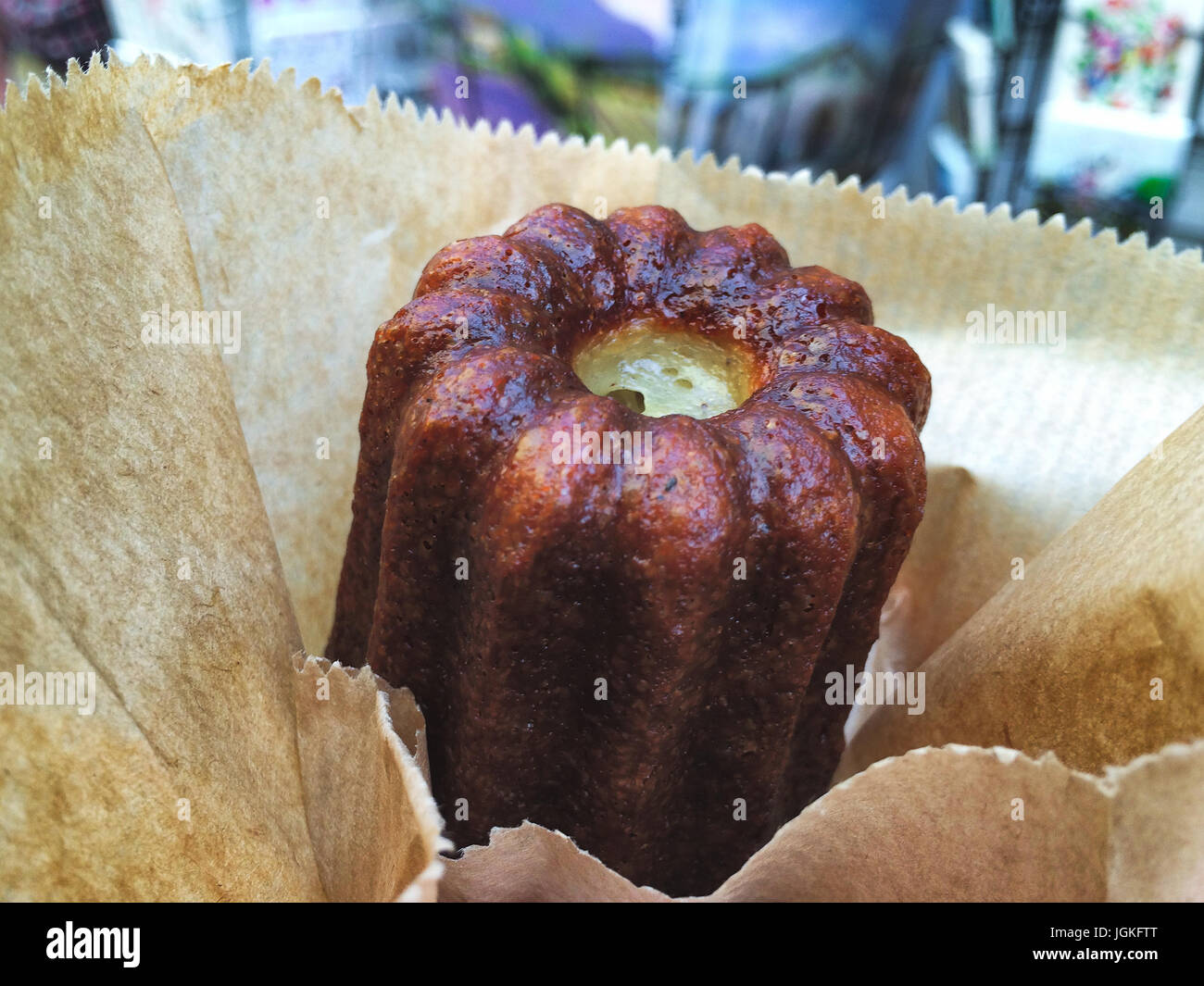 A canelé is a small French pastry flavored with rum and vanilla with a ...